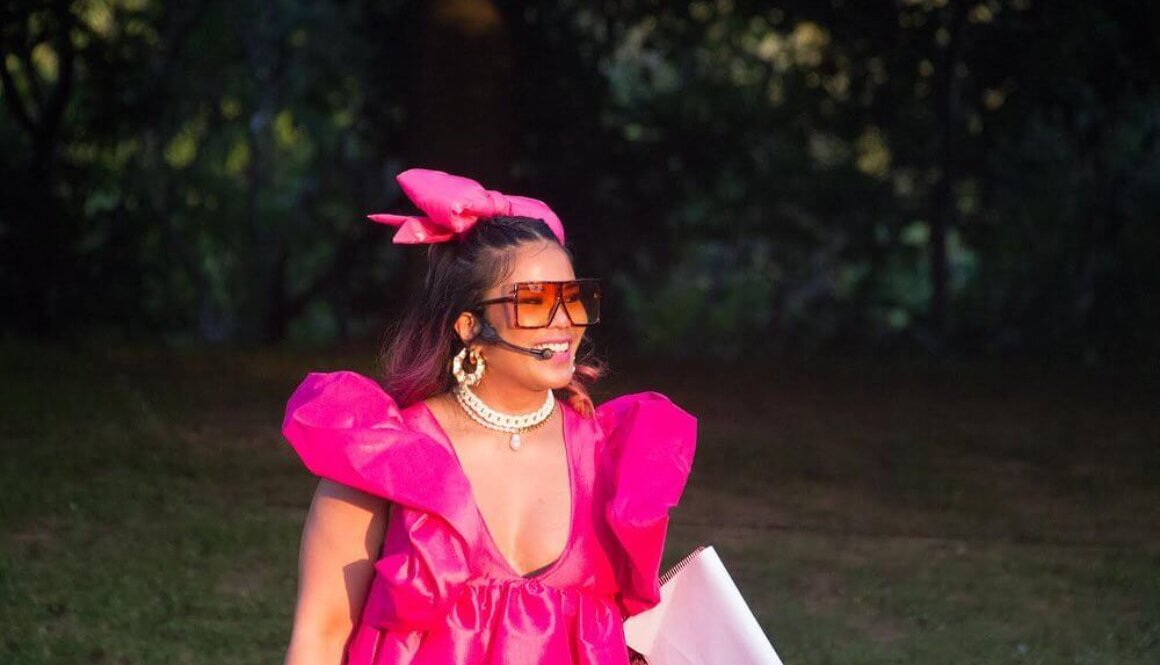 Filipina comedian Fly Lady Di in a pink dress and glasses