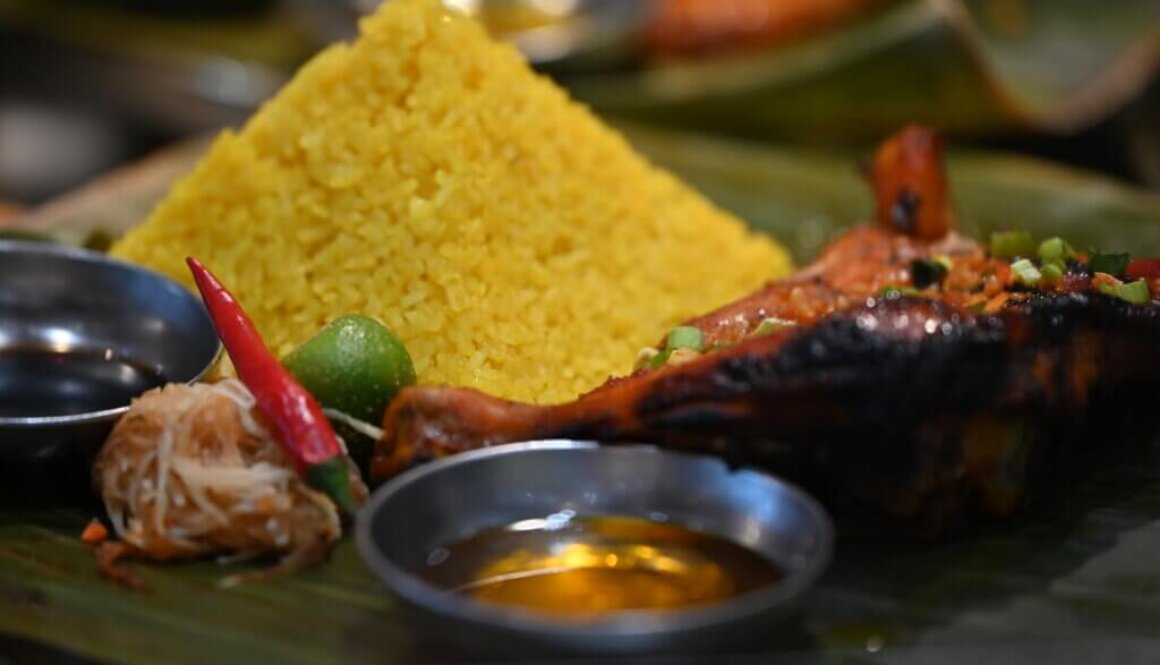 Food from Kabalen Restaurant in Toronto, Ont. shows yellow-hued java rice and grilled chicken. Photo by Yona M. Harvey