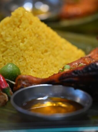 Food from Kabalen Restaurant in Toronto, Ont. shows yellow-hued java rice and grilled chicken. Photo by Yona M. Harvey
